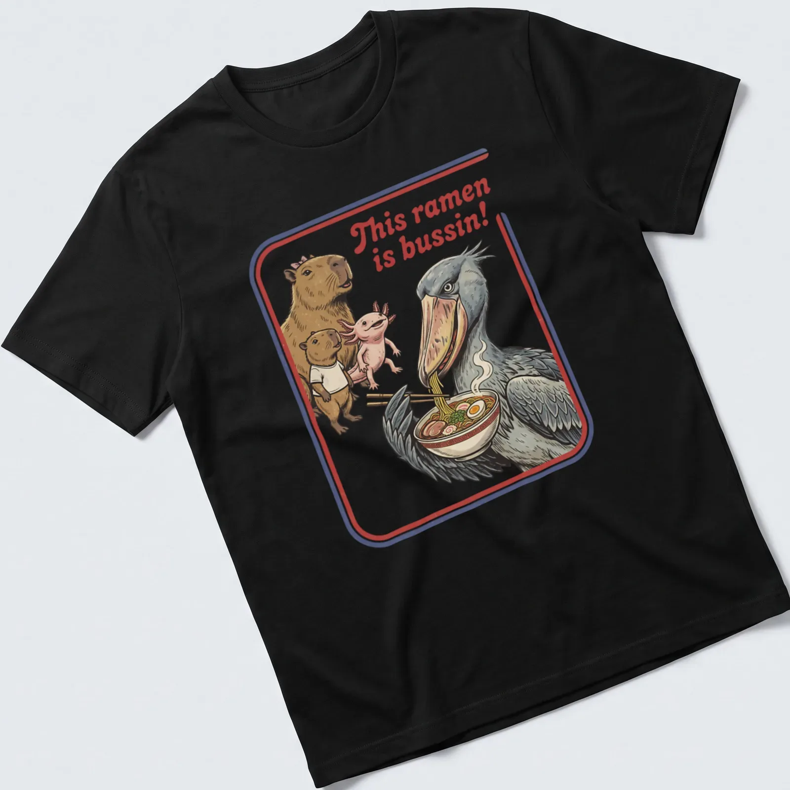 Illustrative t-shirt featuring capybara, axolotl, and shoebill enjoying ramen with vibrant colors — printed on a unisex t-shirt