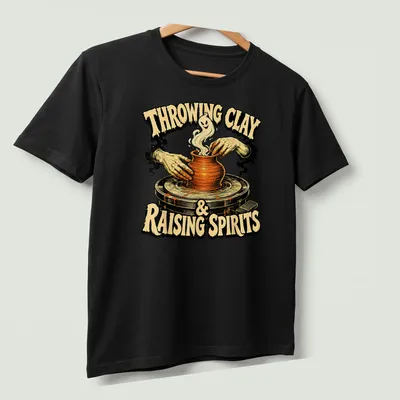 Vintage illustration of hands shaping pottery with a ghost, featuring Halloween-themed text — printed on a unisex t-shirt (angled view)