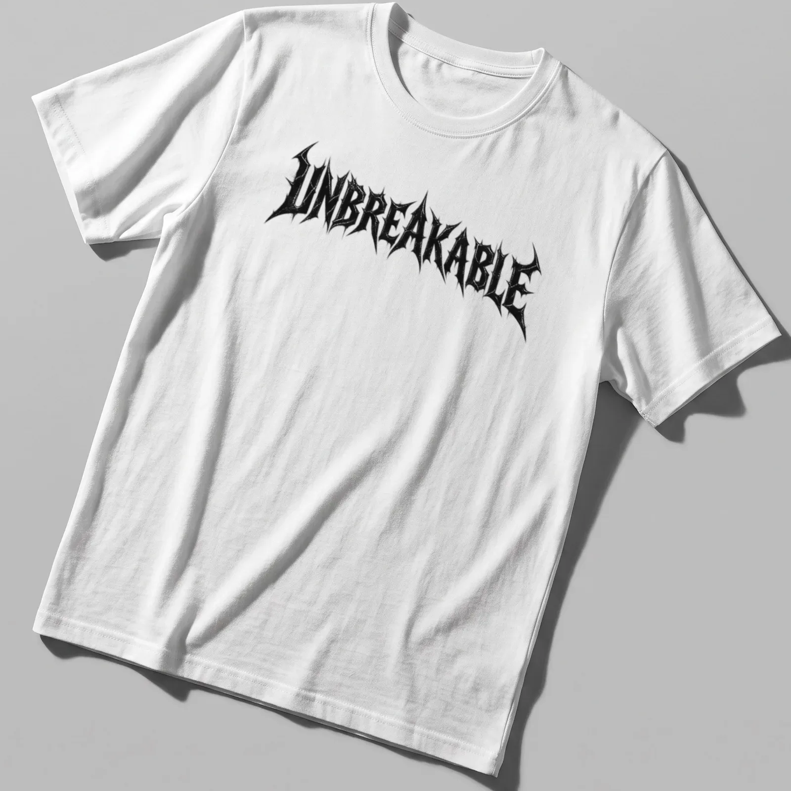 Distressed black T-shirt with bold UNBREAKABLE text in streetwear style — printed on a unisex t-shirt