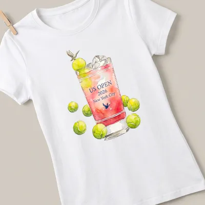 Watercolor design of a cocktail glass with tennis balls and text for US Open 2026. — printed on a women's shirt