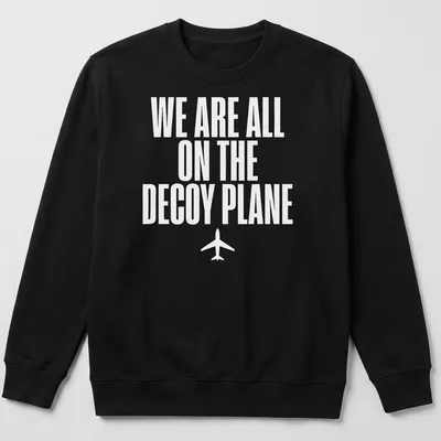 Bold typography t-shirt with the quote 'We Are All On The Decoy Plane' in white — printed on a unisex sweatshirt