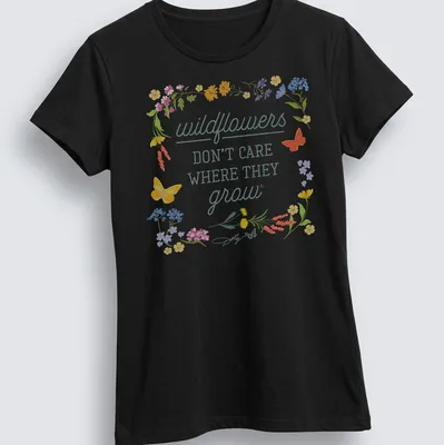 Floral illustration t-shirt with wildflowers and butterflies in various colors — printed on a women's shirt
