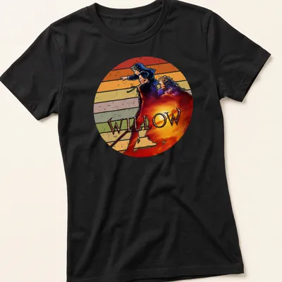 Retro distressed Willow movie t-shirt featuring bold lettering and fantasy characters — printed on a women's shirt