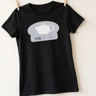 Line art graphic of a Xi Shi Yixing teapot with text in white and blue. — printed on a women's shirt