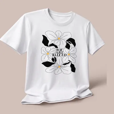 Line-art design featuring flowers with the phrase 'YOU ARE VALUED' in black, white, and yellow. — printed on a unisex t-shirt (angled view)