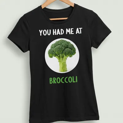 Funny broccoli-themed shirt with playful text in green and white — printed on a women's shirt